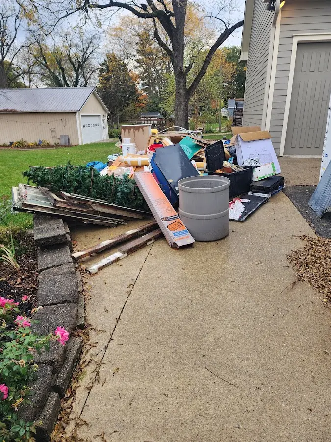 Dumpster being loaded with debris for Residential Dumpster Rental in Carroll